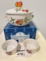 Casserole on box with two ramekins visible