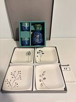 Full lot showing sake set in box and four plates