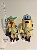 Group shot of LEGO Yoda light, two Yoda dispensers, R2-D2 figure