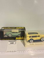 Both boxed Solido Cadillac models side by side