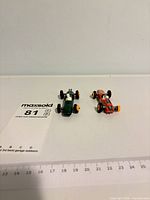 Both cars with ruler for scale