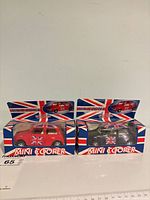 Two boxed Mini Cooper pull-back cars side by side