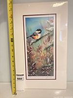 Full view of shrink-wrapped matted print with measuring tape and lot tag