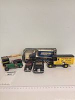 Group shot of five Corgi vehicles with two boxed items