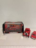 Overview showing all three red fire vehicles with boxed Dennis N Type