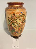 Front view showing figural landscape and overall form