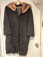 Front view of Persian lamb fur coat showing mink collar