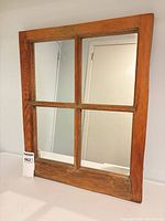 Front view of pine window-pane mirror showing four mirrors and frame
