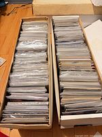 Two long boxes filled with bagged comics viewed from top