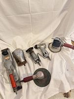 Group shot of all five pneumatic tools laid out