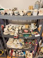 Shelves loaded with royal commemorative china, plates, mugs and keepsakes