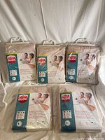 Front view of all five packaged UltraBlok underpads