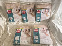 Front view of five sealed UltraBlok underpad packages