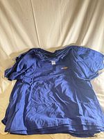 Stack of blue Gildan T-shirts