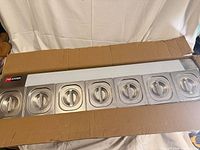 full view of GN holder with all seven lidded pans