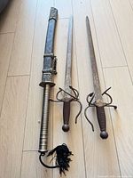All three swords side by side on floor