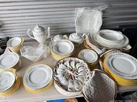 Overall view of Westbury pattern dinnerware laid out on table