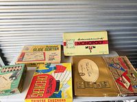 Overall lot view showing six boxed items on table