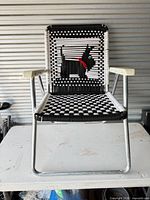Front view of lawn chair showing Scottie dog weave