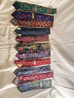 All ten ties laid out full length to show patterns