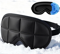 Front view of black 3D contoured eye mask on snow with gel insert shown