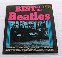 Front sleeve showing title, label logo, band photo and track listing