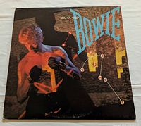Front album cover featuring David Bowie artwork