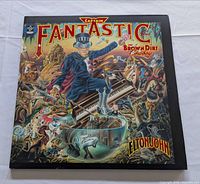 Front cover with Captain Fantastic artwork and Elton John name