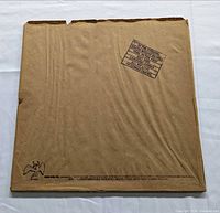 Brown paper outer sleeve with stamp and Swan Song angel logo