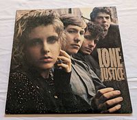 Front album jacket showing title and band photo