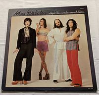 Front of LP jacket showing title and band photo