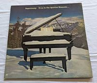 Front of album jacket showing snow-covered piano scene