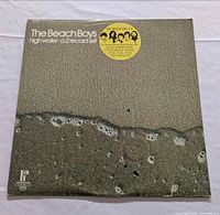 Front cover with title, sticker, artwork