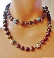 Necklace worn on mannequin showing overall appearance and bead pattern