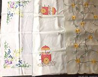Three tea cloths side by side showing all designs