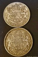 Obverse and reverse of both 50-cent coins together