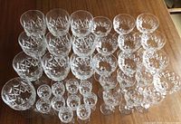 All 36 Stuart Park Lane crystal glasses grouped on table