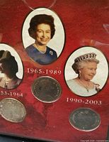 Front view of folder showing portraits and three coins