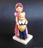 Front view showing full figurine, colors, composition