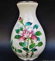 Front view showing rose enamel decoration and shape