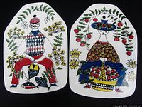 Front view of both Mons og Mille plaques showing artwork and condition