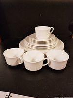 Stacked view of plates and cups showing overall set