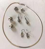 Entire lot with necklace and four earring pairs displayed