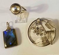 Group shot of ring, brooch, and pendant
