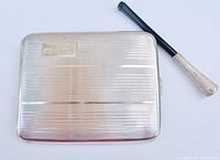 Front view of cigarette case with holder