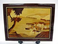 Front view shows full marquetry countryside scene