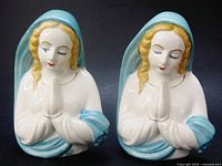 Front view of both praying Madonna planters