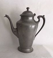 Front view of pewter coffee pot showing overall form