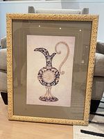 Front view of framed ewer print showing artwork, mat and carved gold frame