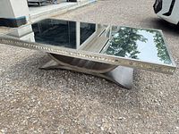 Full view of rectangular coffee table outdoors